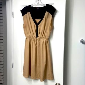 Tan and black dress.